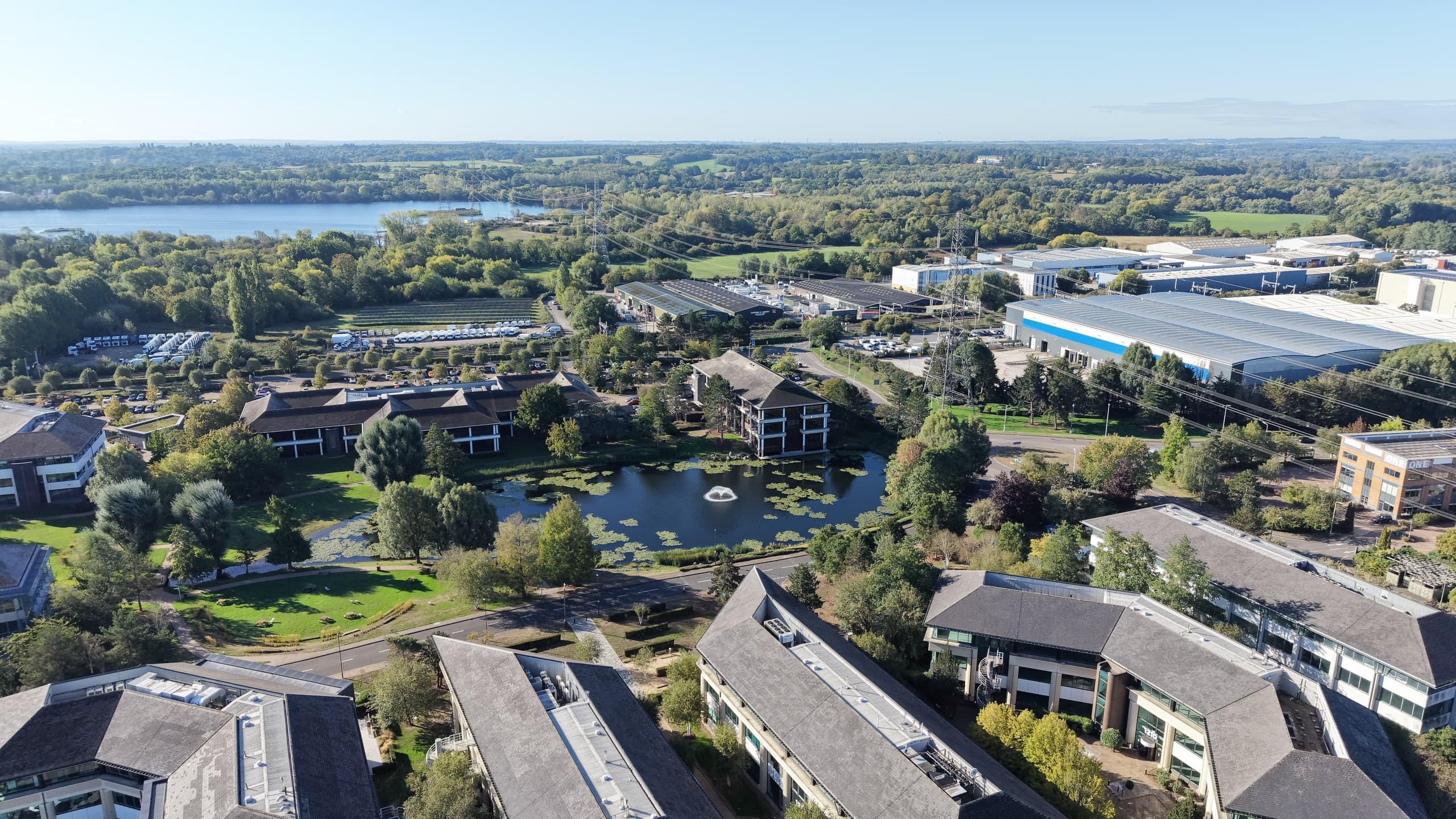 Aerial view across the lakes and buildings at Arlington Park